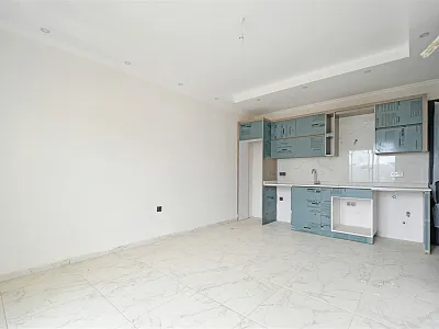 Квартира планировкой 1+1 в новом жилом комплексе в районе Махмутлар