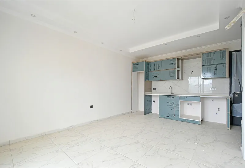 Квартира планировкой 1+1 в новом жилом комплексе в районе Махмутлар