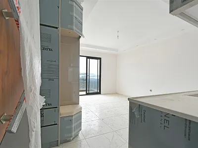 Квартира планировкой 1+1 в новом жилом комплексе в районе Махмутлар