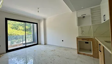 Квартира планировкой 1+1 в живописном районе Авсаллар Аланья 